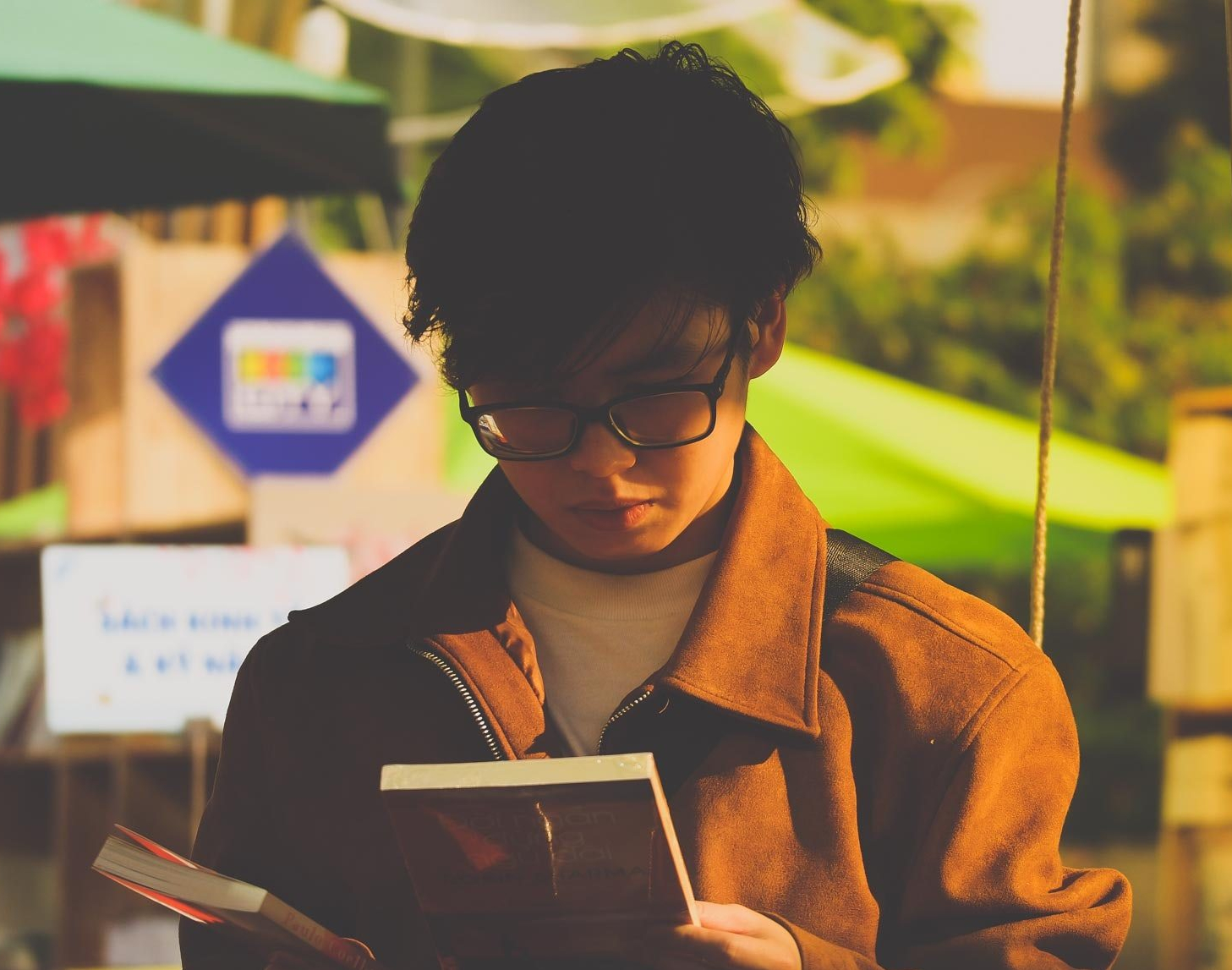 Boy reading book. Photo by Bùi Nam Phong from Pexels.